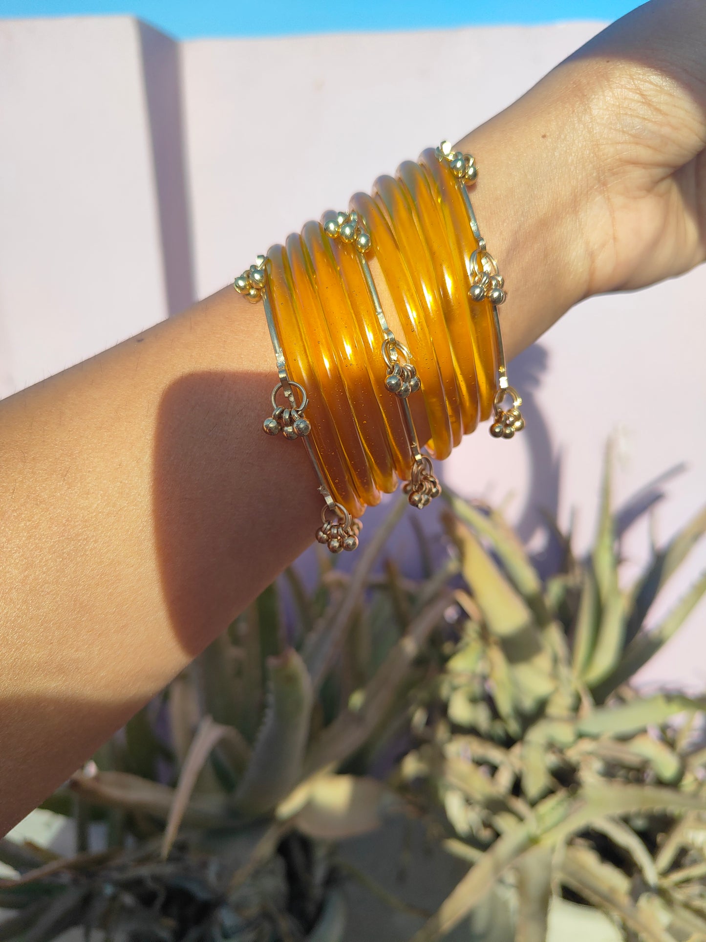 Yellow jelly bangles with ghungroo bangles