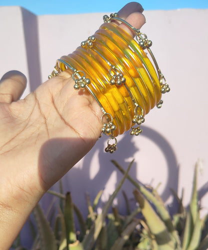 Yellow jelly bangles with ghungroo bangles