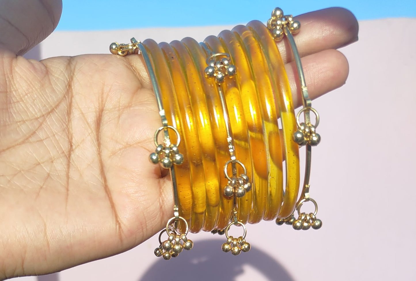 Yellow jelly bangles with ghungroo bangles